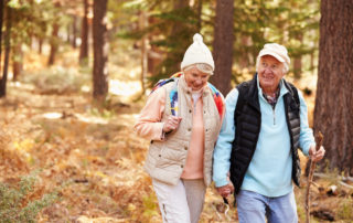 A senior couple out on a fall hike