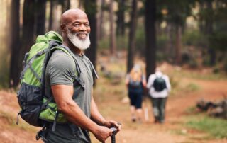 A senior man out on a hike with friends