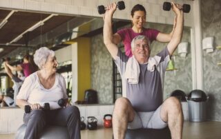 Two seniors working out and staying active at the senior living community in Madison Heights
