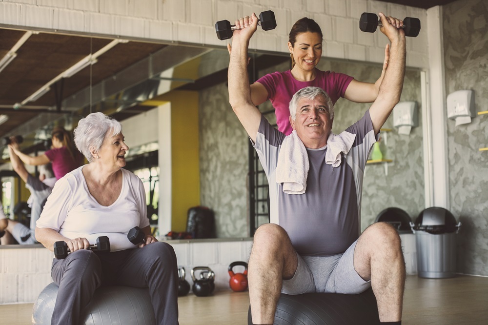 Two seniors working out and staying active at the senior living community in Madison Heights