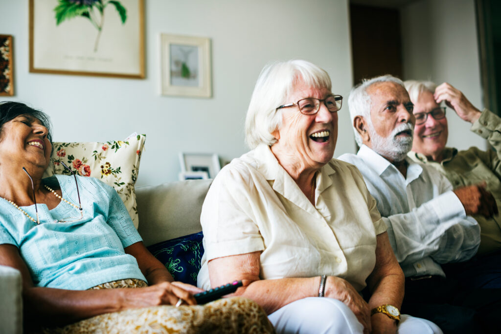 Friends laughing in independent senior living in Michigan. 