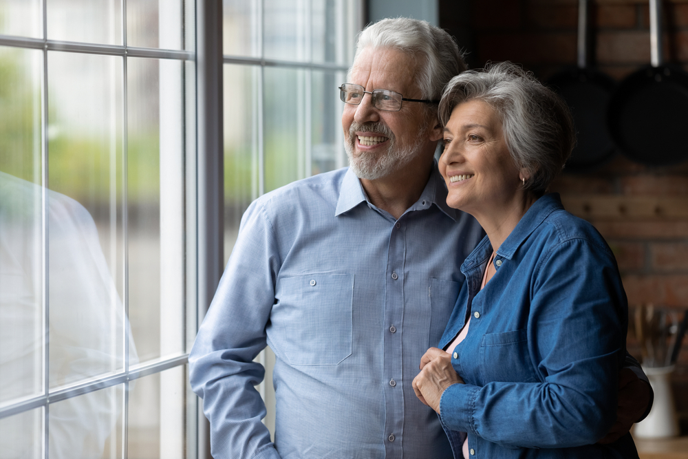 Seniors smiling in independent senior living in Michigan.