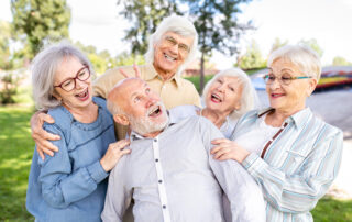 Senior friends outside enjoying senior living communities Michigan