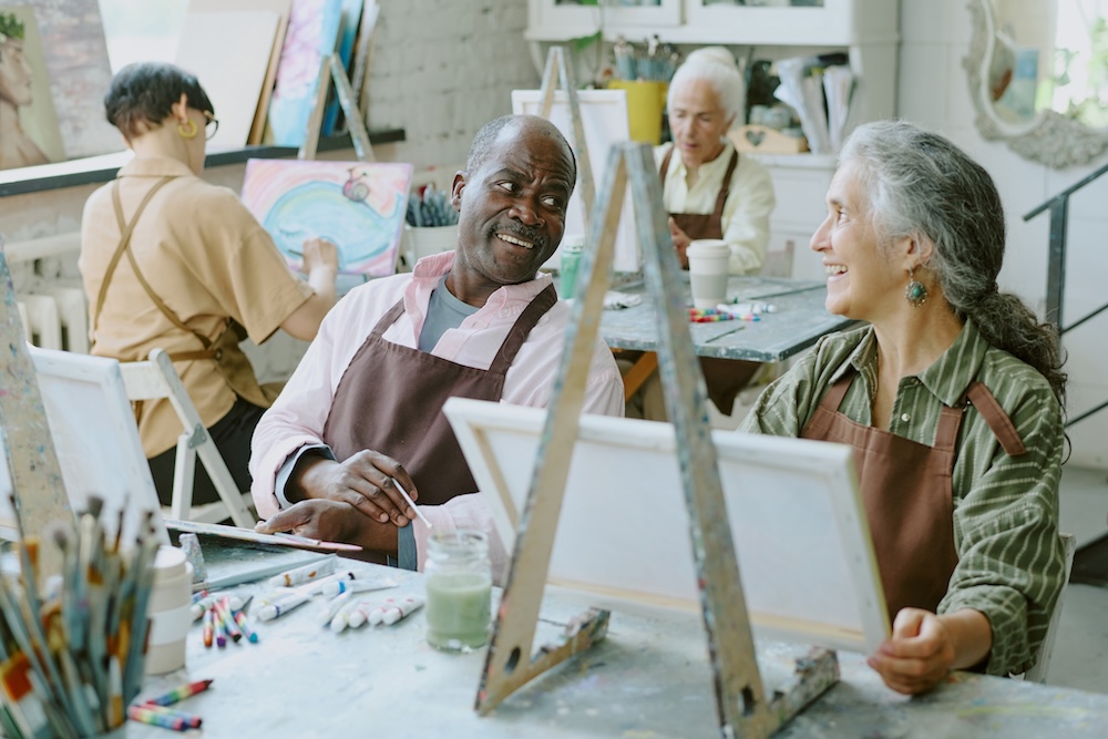 Seniors taking an art class at senior living communities Michigan